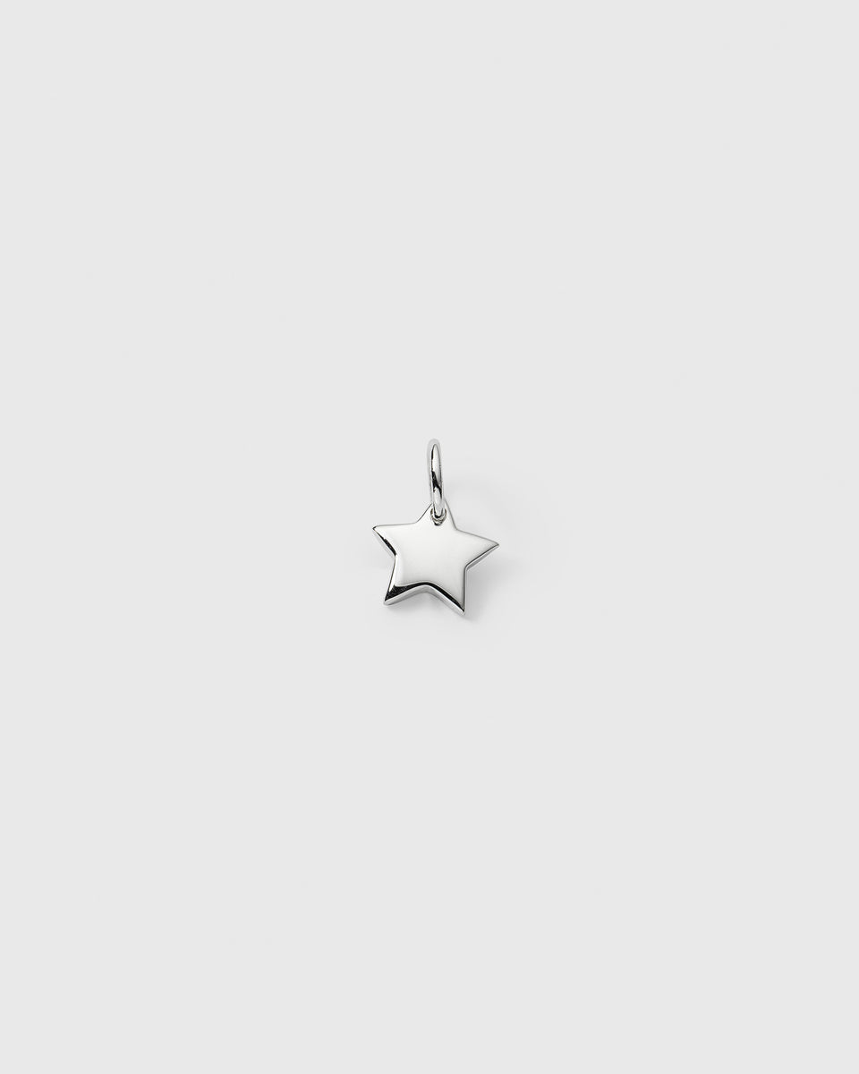 A product shot of the Beloved Star Pendant in silver, showcasing its classic, polished star design.
