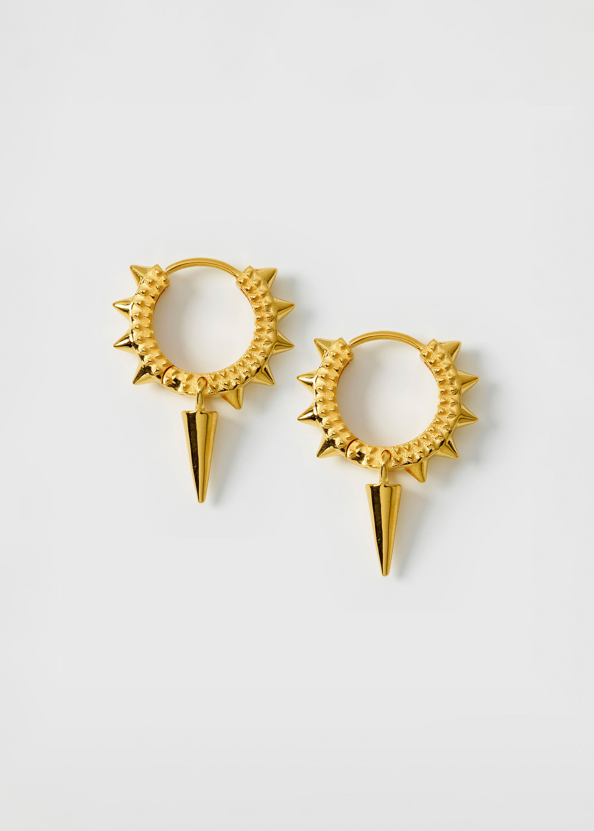 A product shot of the Harvey Heavy Spike Hoops in gold, featuring a textured design with spikes around the hoop and a larger dangling spike.