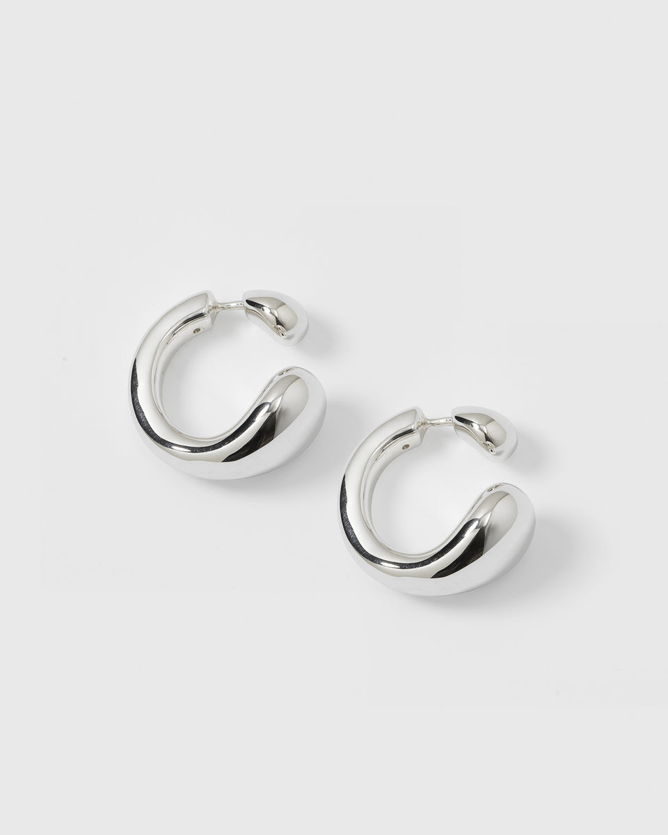 A product shot of the Bolded Drops Earrings in silver, showcasing their unique, bold, and drop-inspired shape.