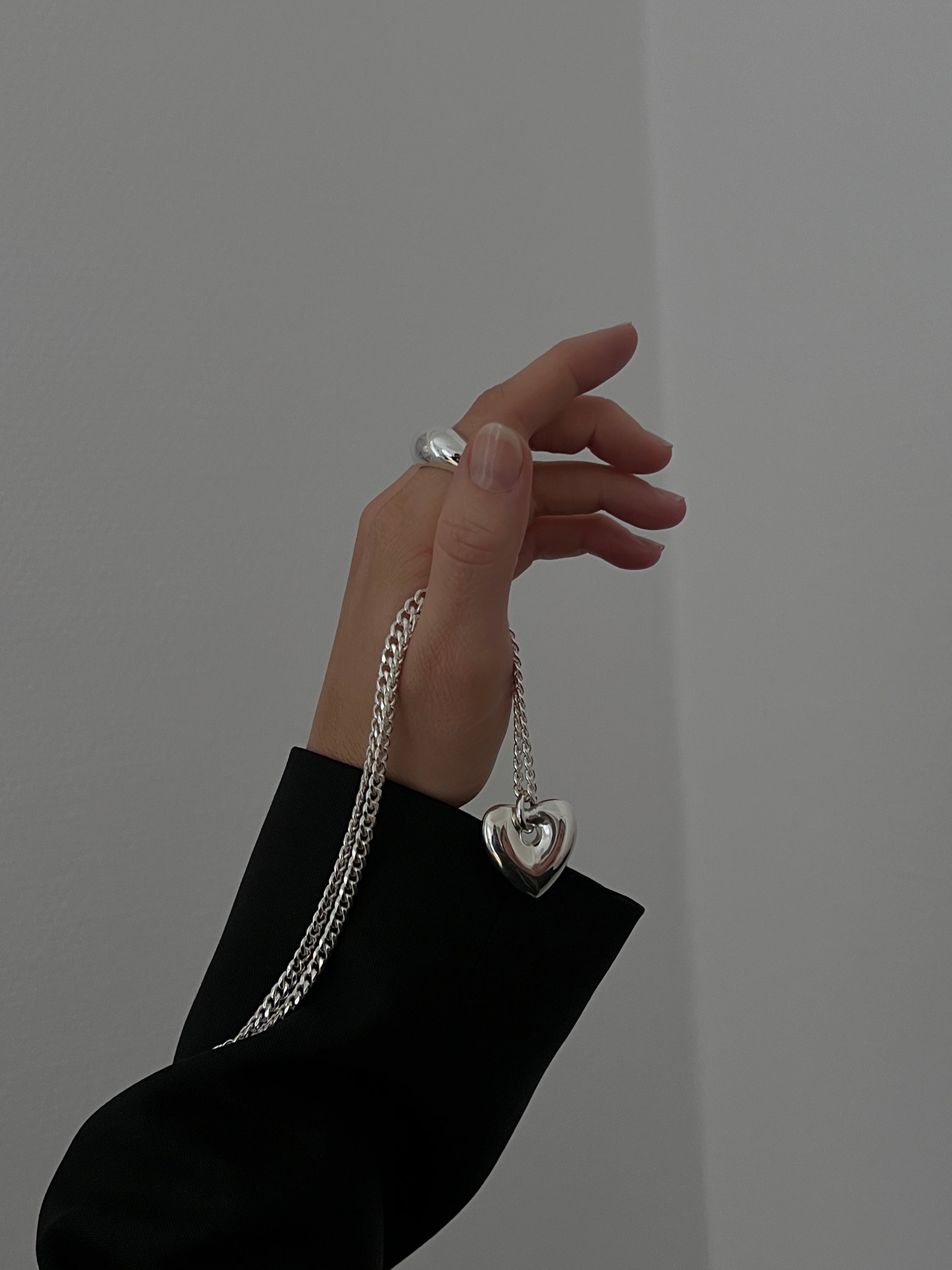 Silver necklace with a fat heart