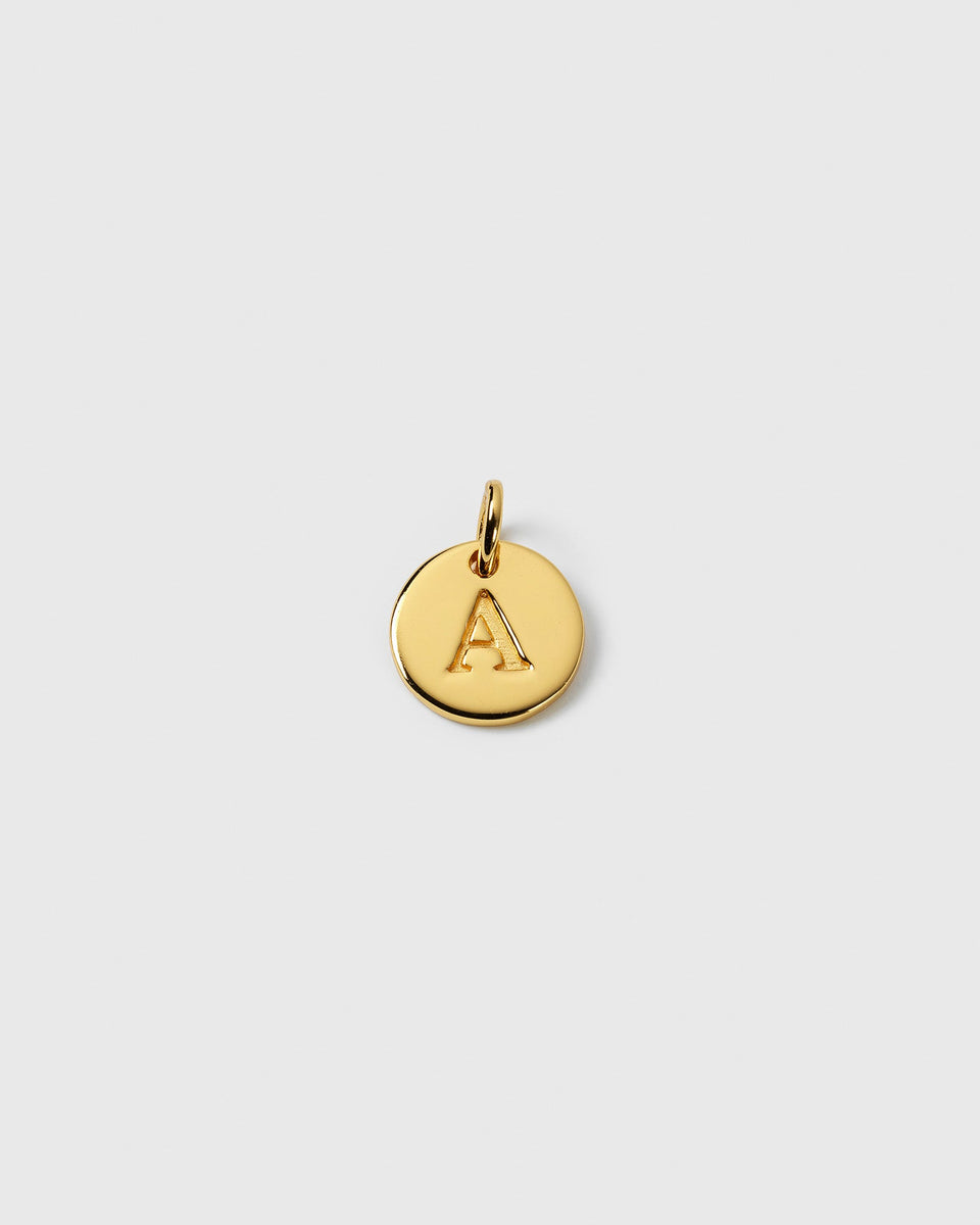 Product shot of the gold Beloved Mini Letter charm, a small round pendant with the initial 'A'.