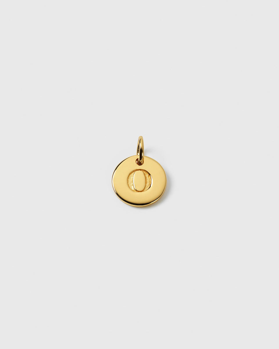 A product shot of the Beloved Mini Letter 'O' pendant in gold, a small circular charm with the letter engraved in the center.