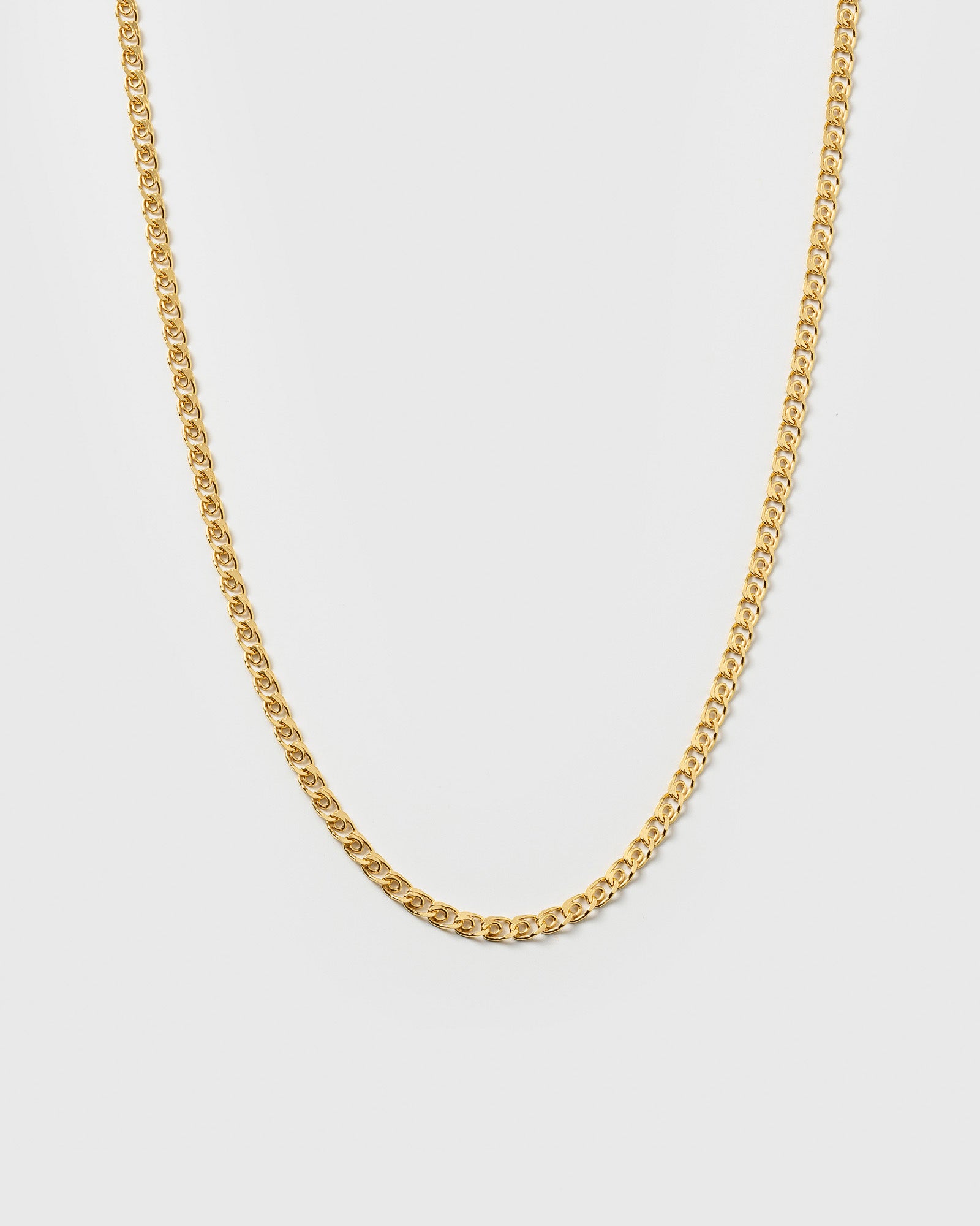 A product shot of the Sheer Love Necklace in gold, featuring its distinctive patterned chain.
