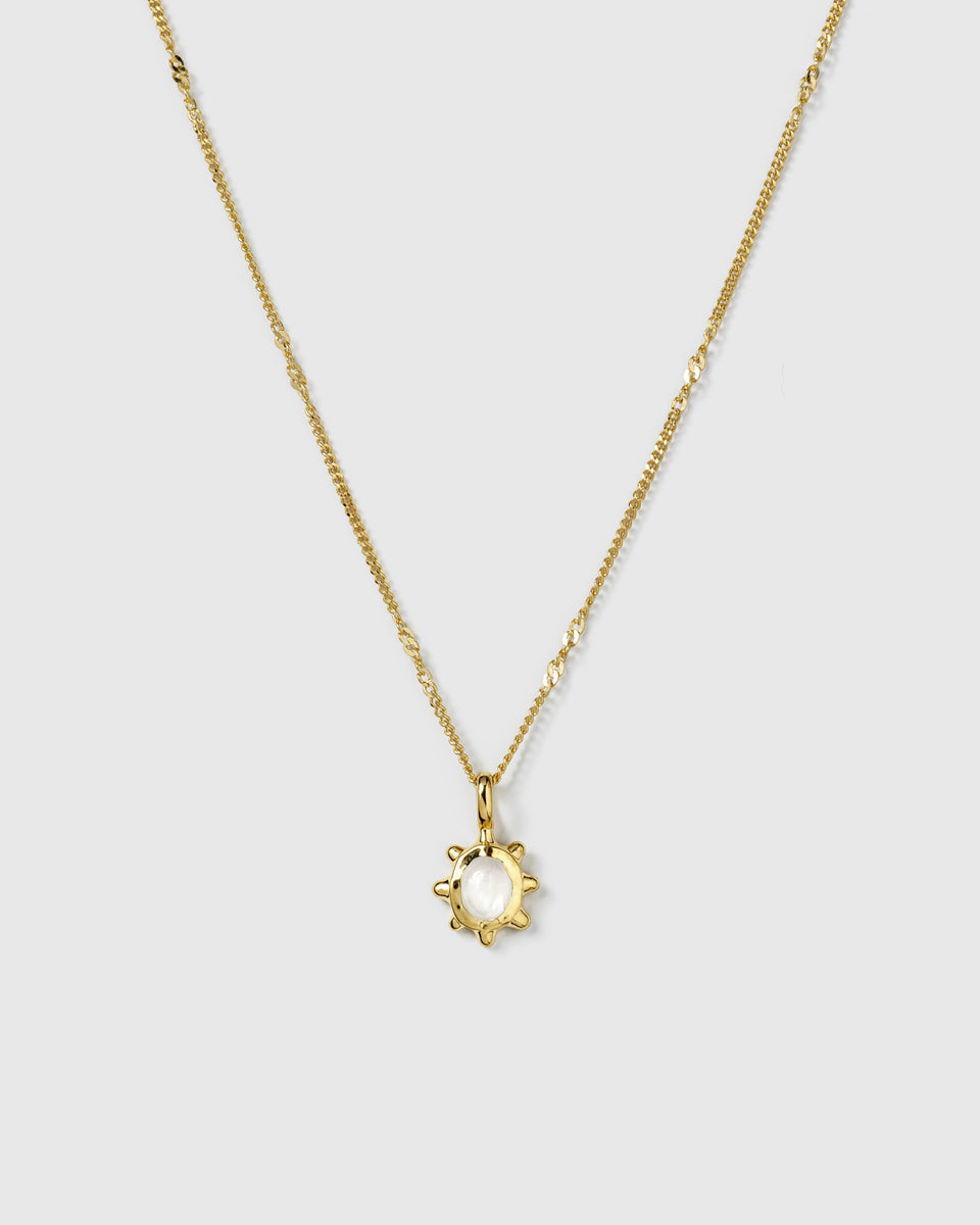 A product shot of the Florentina Necklace in gold, featuring a flower-shaped pendant with a central moonstone on a delicate, twisted chain.
