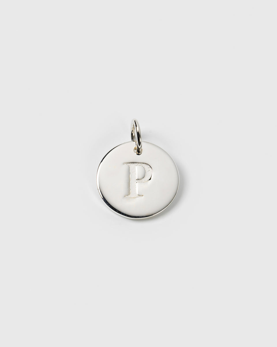 A product shot of the Beloved Big Letter Silver pendant, a circular charm in polished silver with the letter 'P' engraved in the center.