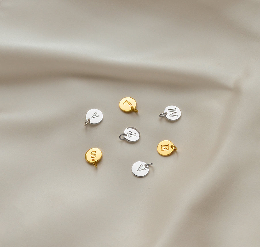 Mini letter in gold and mini letter in silver