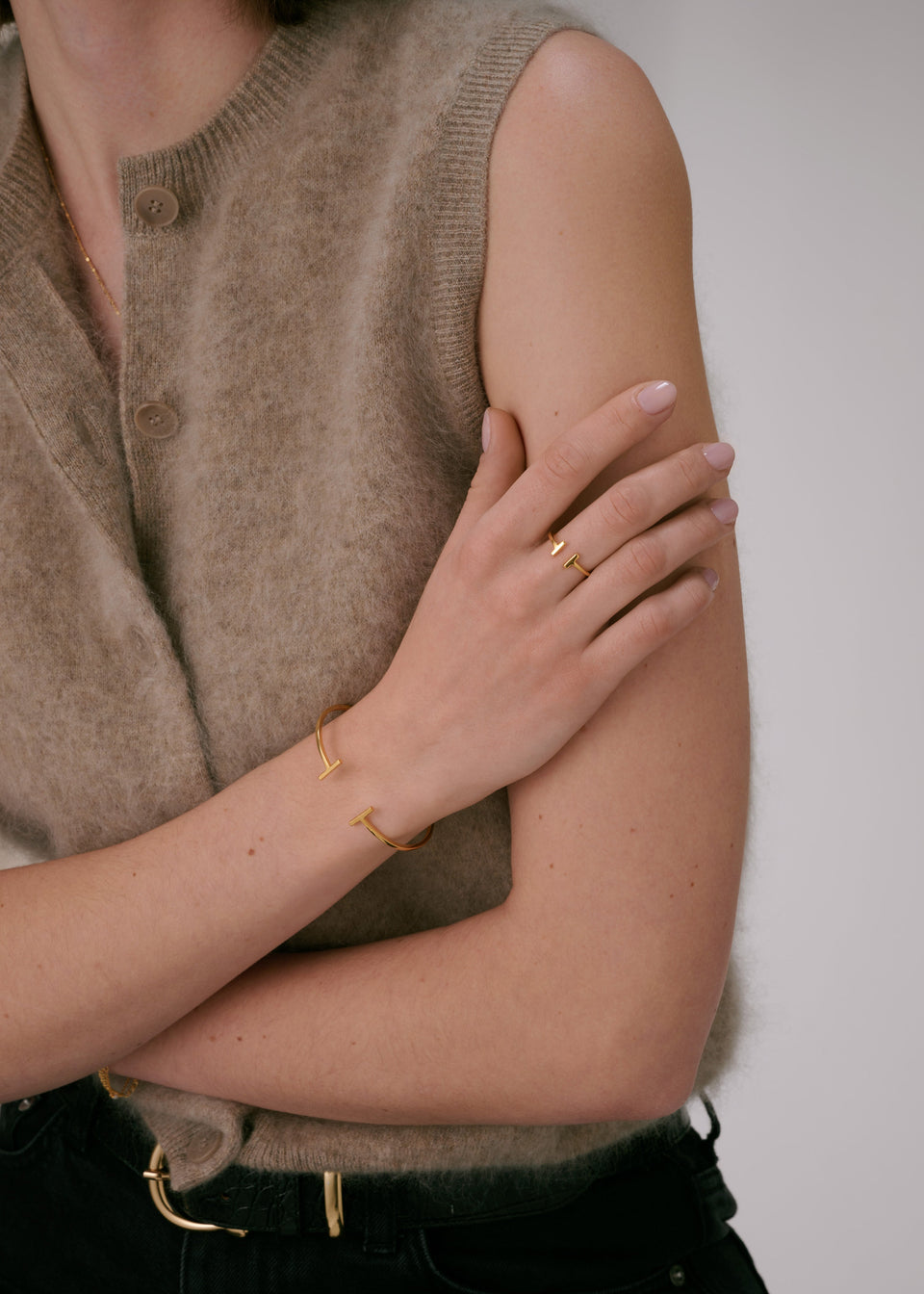 Gold bar ring, matching gold cuff bracelet, and a delicate gold chain necklace