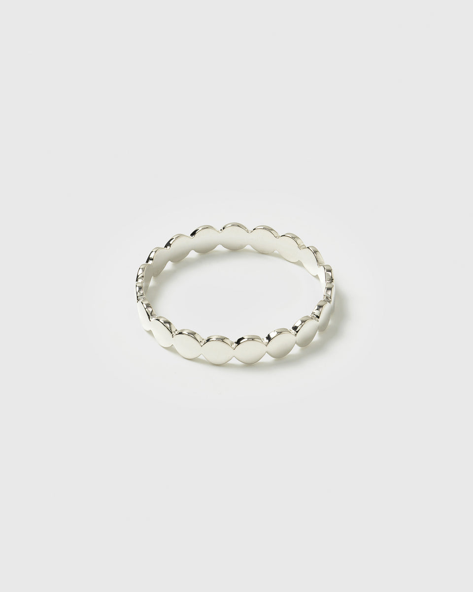A product shot of the Beaches Flat Dots Ring in silver, displaying its full circular shape and delicate, flat dotted band design.