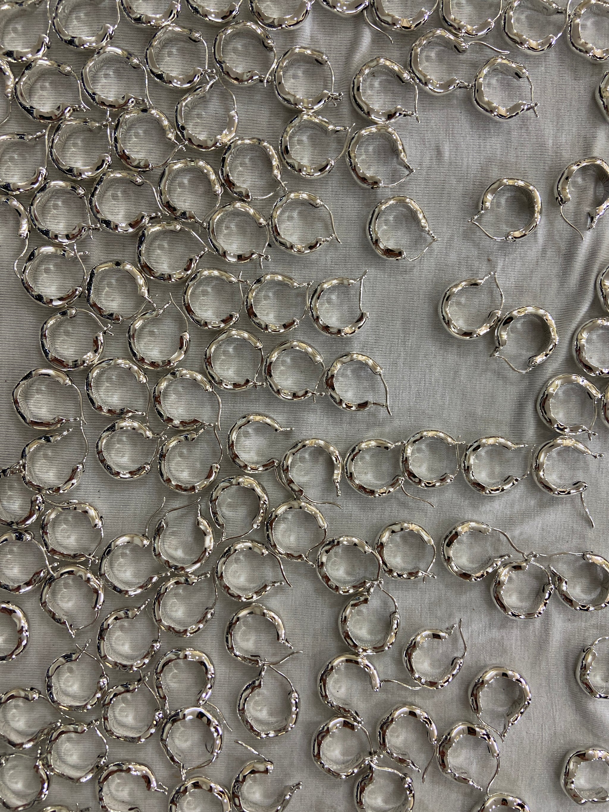 Bolded Wavy Earrings all done in one of our factories in India. All our jewelry is made from 100% recycled sterling silver.